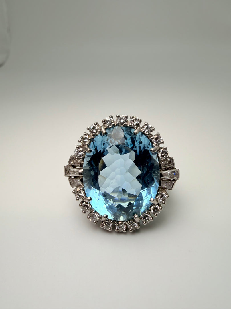 Platinum Oval 13.32Ct Aqumarine Ring With Diamond Halo Weighing 0.95CTW