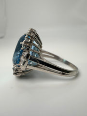 Platinum Oval 13.32Ct Aqumarine Ring With Diamond Halo Weighing 0.95CTW