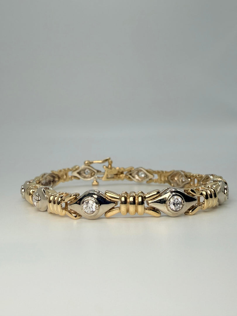 14Kt Yellow Gold And Diamond Tennis Bracelet With 10 Bezel Set Round Stones Weighting Approximately 0.60Tw