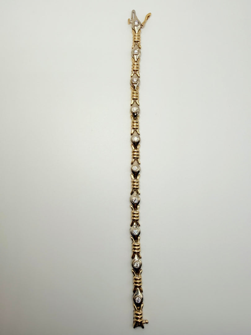 14Kt Yellow Gold And Diamond Tennis Bracelet With 10 Bezel Set Round Stones Weighting Approximately 0.60Tw