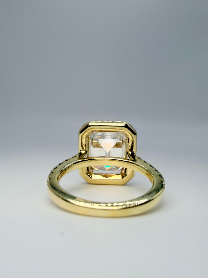 14Kyt Yellow Gold 3.37Ct "Forever One" Emerald Cut Moissanite Center Stone With Diamond Halo And Down The Band Totaling 0.95Cts G-Si