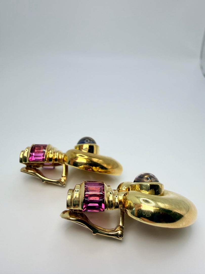18Kt Yellow Gold Clip Earrings With Pink Tourmaline Channel Set Emerald Cut Stones And Blueish Purple Cabachon Stone