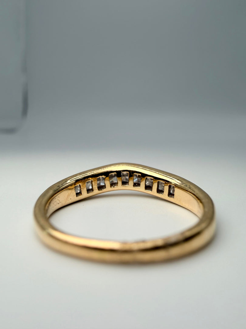14Kt Yellow Gold Curved Band With 9 Princess Cut Diamonds