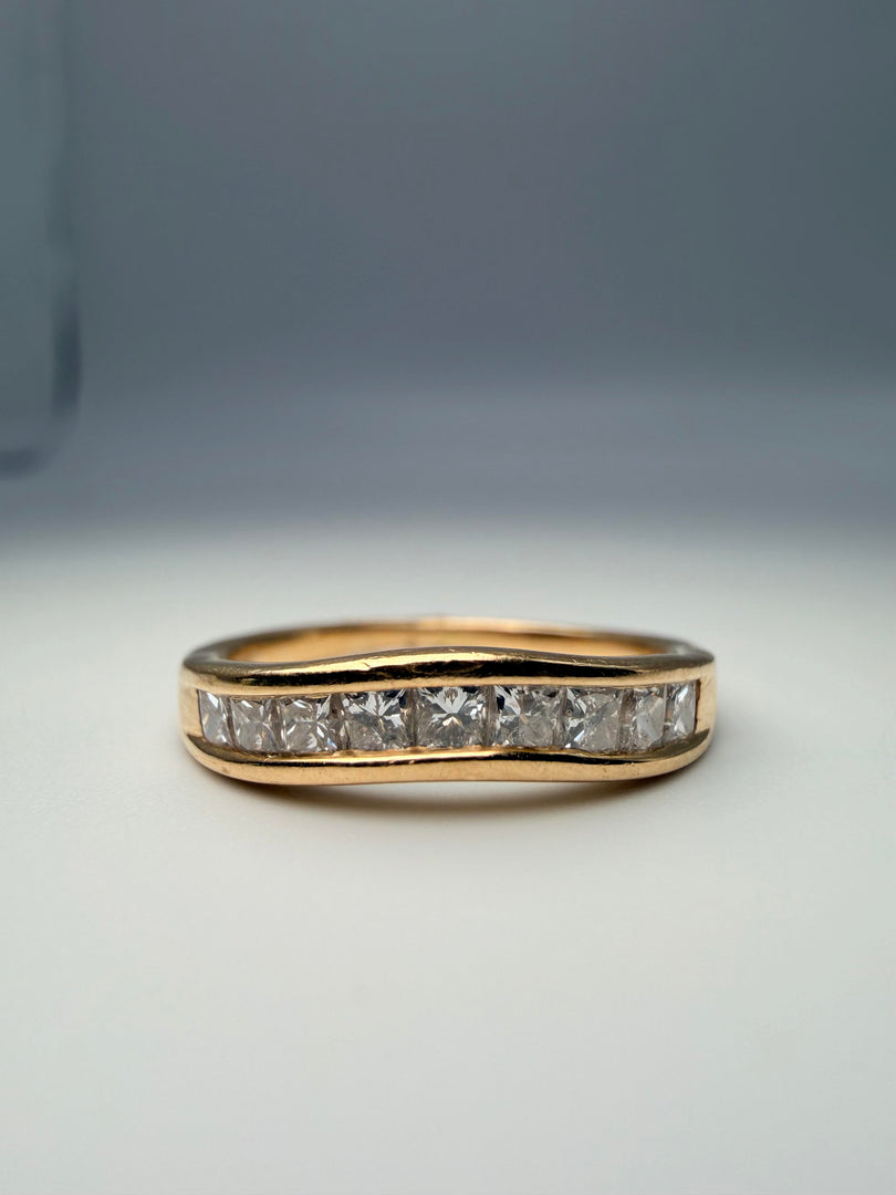 14Kt Yellow Gold Curved Band With 9 Princess Cut Diamonds