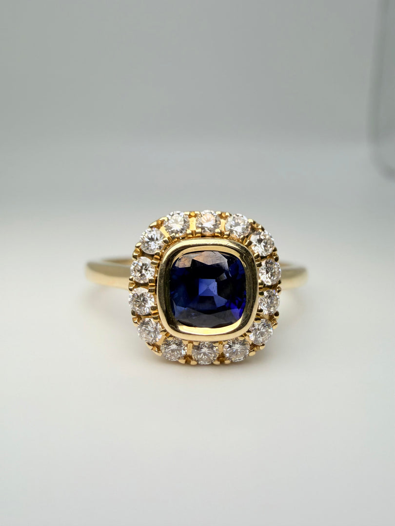 14Kt Yellow Gold .75Ct Sapphire Bezel-Set Center With 1/4Tw Diamond Halo Ring (25091075)