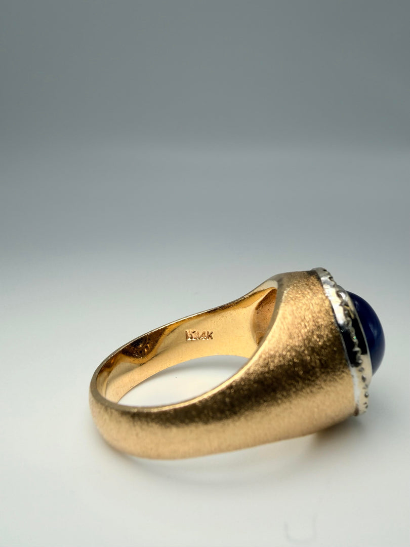 14Kt Yellow Gold Ring With Synthetic Blue Star Sapphire Cabochon Stone Surrounded By 22 Round Brilliant Diamonds Totalling Approximatley 0.25Ct