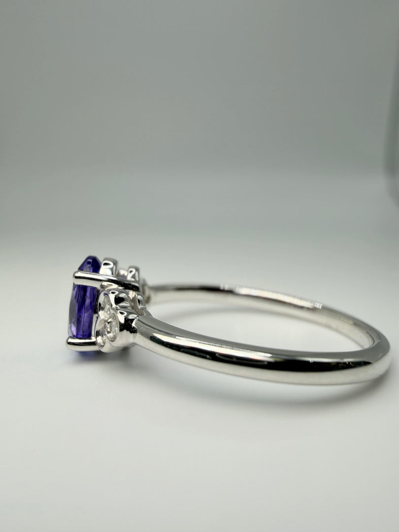 14Kt White Gold .87Ct Oval Tanzanite Center With .09Tw Diamonds Ring (25210881)