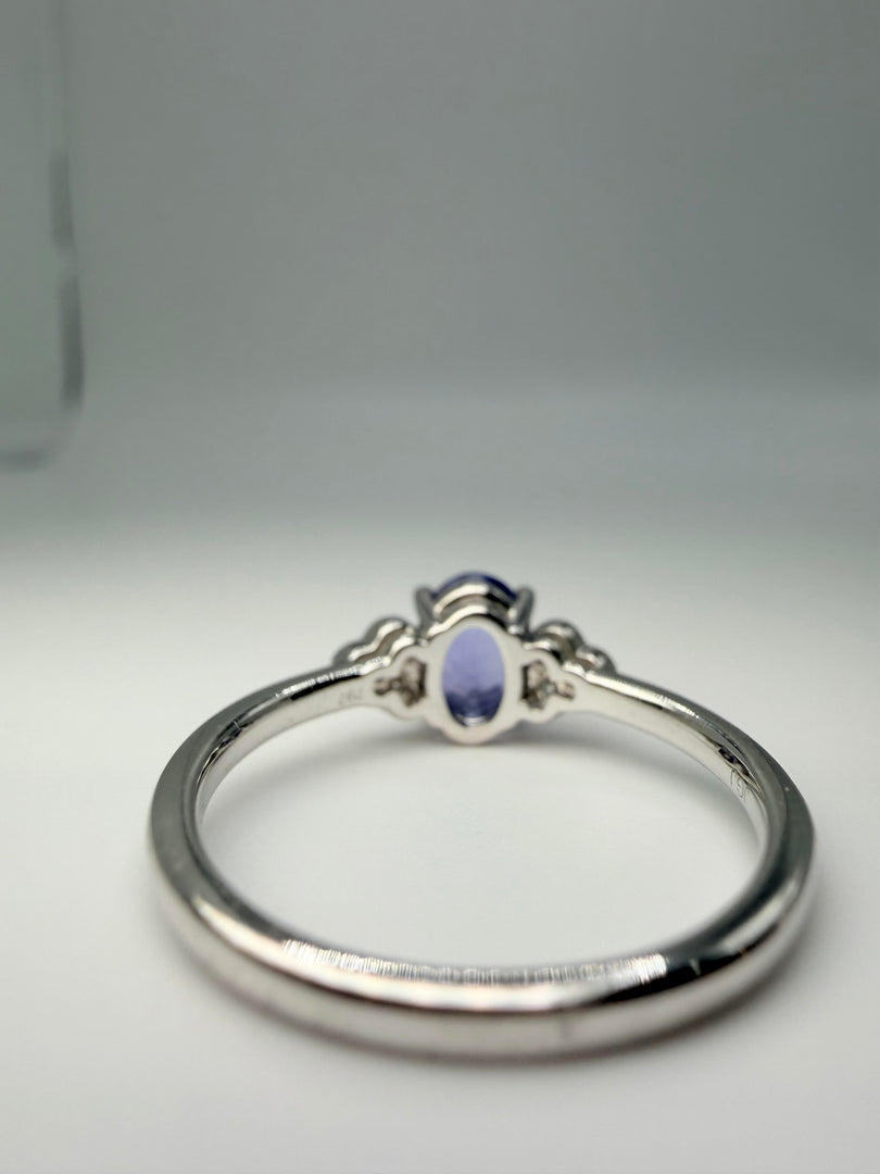 14Kt White Gold .87Ct Oval Tanzanite Center With .09Tw Diamonds Ring (25210881)