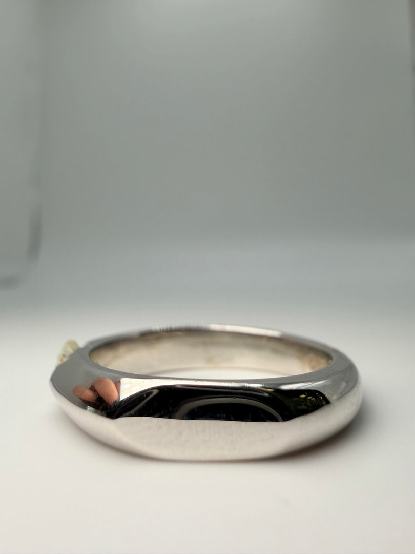 14Kt White Gold Tension Set Diamond Ring With A 0.40Ct J/Vsi  Round Stone With Flat Sides On A Wide Band