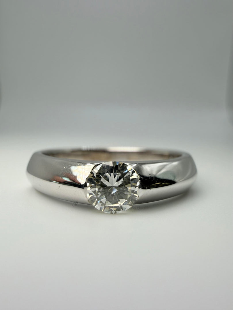 14Kt White Gold Tension Set Diamond Ring With A 0.40Ct J/Vsi  Round Stone With Flat Sides On A Wide Band
